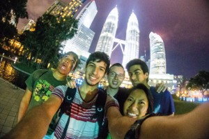 Honors tour members take a selfie in Kuala Lumpur, Malaysia, with the Petronas Towers in the background.